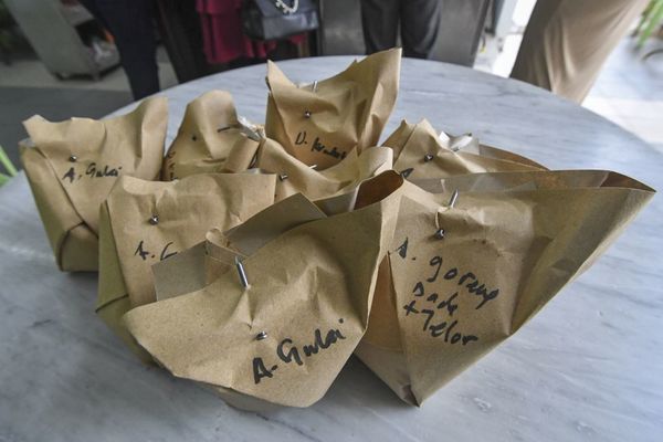 An example of a restaurant using nails to secure their food packaging.