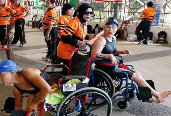 File photo of Koh (right) during one of her ASIAN Para Games outings.