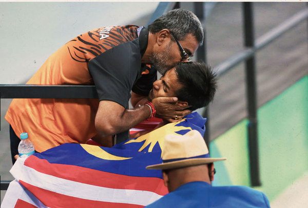 Jeganathan with Ridzuan after he won the first-ever gold at the Rio 2016 Games.