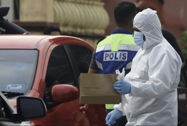 Investigators seen collecting evidence at the couple's home in Rasah Kemayan, Seremban 2.