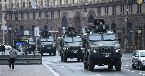 Ukrainian military vehicles move past Independence square in central Kyiv on 24 February 2022.