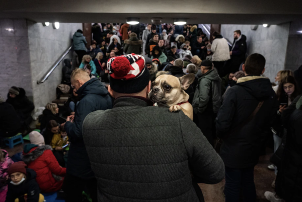 Hundreds of people, including many women and children, take shelter inside a metro station as explosions are heard in downtown Kharkiv, Ukraine, on 24 February 2022.