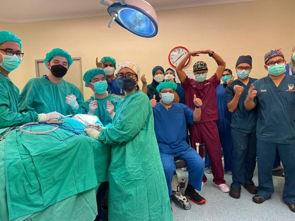 Dr Shaiful and the surgical team posing happily after the removal of the tumour was completed.