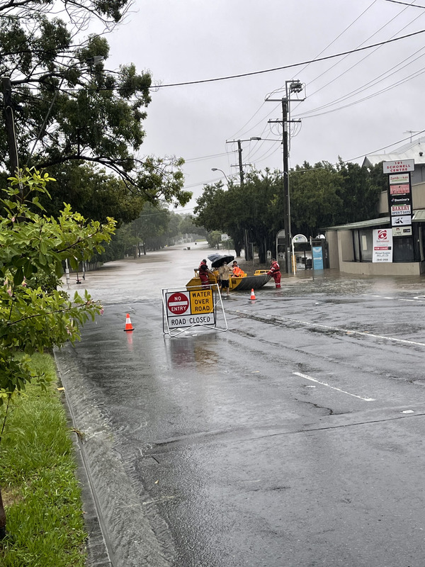 Boat being used by State Emergency Service (SES) to evacuate people in St Lucia, a suburb in Brisbane, Queensland, on the morning of the 27 February 2022, after a flood warning was issued the night before.