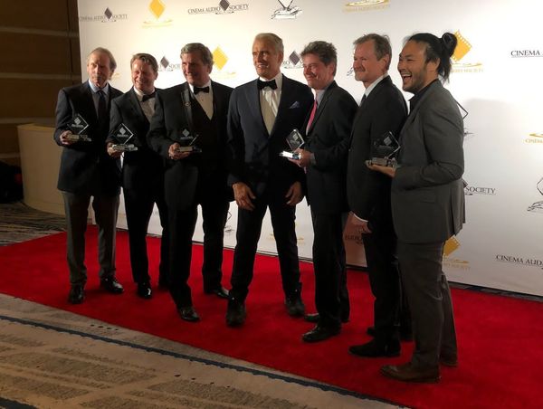 Wee (right) with his colleagues (from left) Doc Kane, Paul McGrath, David Fluhr, Dolph Iundgren, and David Boucher from Encanto's sound mixing team at the 58th CAS Awards ceremony.