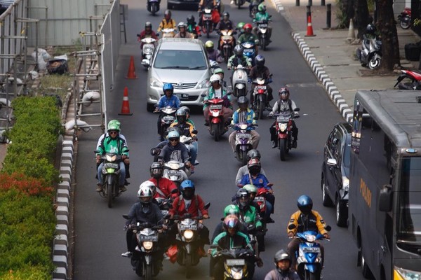 Motorcyclists along Rasuna Said street in South Jakarta.