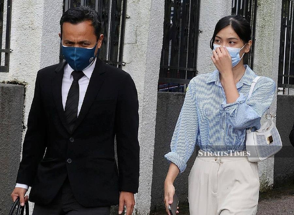 27-year-old defendant Sam Ke Ting (right) and her lawyer Muhammad Faizal Mokhtar.