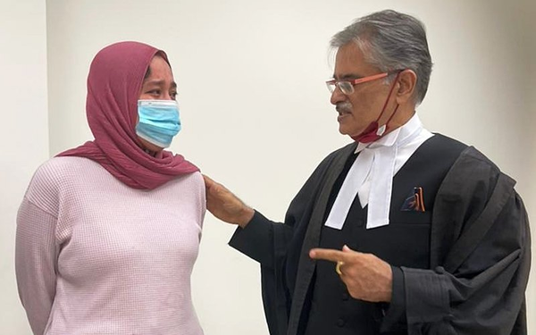 Etiqah (left) with lawyer Datuk Rakhbir Singh appearing at the court yesterday.